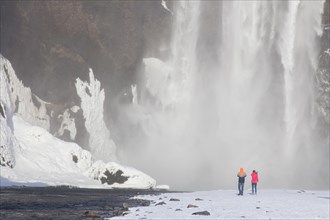 Tourists in front of Skogafoss