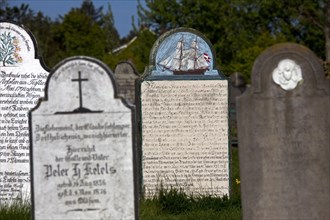 Tombstones of sailors at the graveyard of the St. Laurentii church at Suederende on the island of Foehr