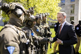 Federal Minister of Finance Christian Lindner with members of the special unit Zentrale Unterstuetzungsgruppe Zoll