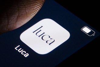 The Luca app is displayed on a smartphone. Berlin