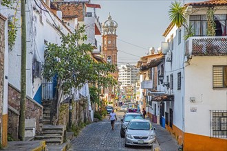 Street and Church of Our Lady of Guadalupe in the city Puerto Vallarta