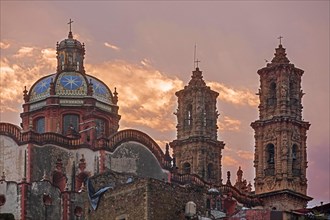 18th century Church of Santa Prisca with its Churrigueresque twin towers in the colonial city centre of Taxco de Alarcon at sunset