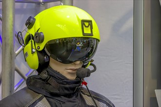 Doll's head with light green pilot's helmet