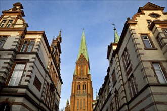 View of Schwerin Cathedral St. Marien and St. Johannis from an old town alley
