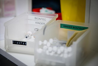 Drawn-up syringes with the BioNTech Pfizer vaccine for children lie ready for use in a COVID-19 vaccination and testing centre at the Olsen car dealership in Iserlohn