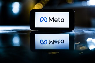 The logo of the technology company Meta stands out on a display in Berlin