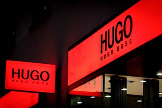 Logos of the fashion manufacturer HUGO Boss at a branch in Berlin