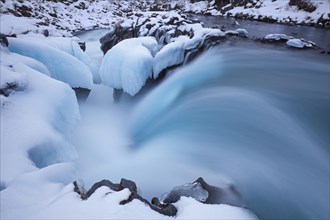 Hlauptungufoss waterfall on the Bruara river in winter