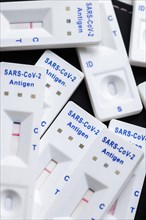 Negative SARS-CoV-2 Rapid Ag Antigen rapid tests lie on a table. Berlin
