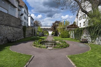 The town garden in the former moat of the historic old town of Radolfzell with spring-like vegetation