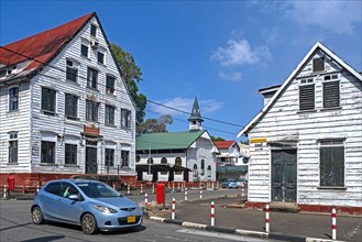 White wooden houses and little church in Dutch colonial style in the historic inner city of Paramaribo