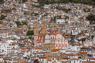 View over the colonial city centre of Taxco de Alarcon and the 18th century Church of Santa Prisca