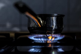 A blue flame on a gas cooker