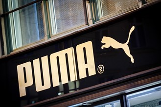 The logo of the sporting goods manufacturer PUMA in a branch in Berlin