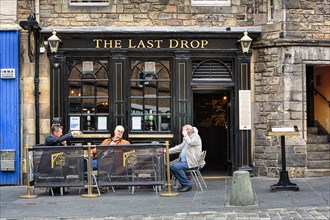 Visitors outside The Last Drop pub