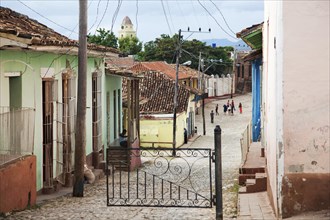 Colonial street with pastel coloured houses in the center of Trinidad