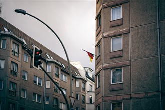 A German flag hangs from a residential building near Hackescher Markt in Berlin
