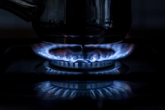 A blue flame on a gas cooker