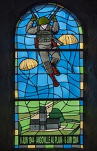Stained glass window dedicated to the 101st Airborne paratroopers in the church at Angoville-au-Plain