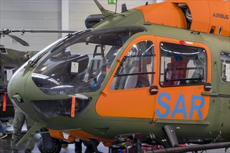 Detail of a Bundeswehr SAR helicopter with cockpit and orange doors