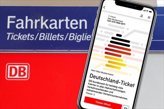 Germany ticket D-ticket or 49 euro ticket on a mobile phone with ticket vending machine photo montage in Stuttgart