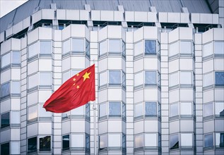 The flag of the People's Republic of China waves in the wind in front of the Chinese Embassy in Berlin. 02.02.2022.