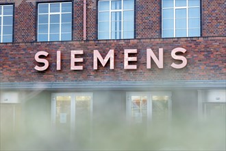 A Siemens company sign in front of a branch office in Siemensstadt in Berlin