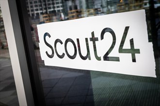 A logo of the Scout24 company is located at a branch office in Berlin