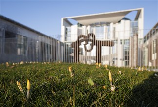 Crocuses bloom in front of the Federal Chancellery in Berlin. 16.03.2022.