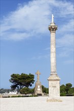 Column of the Madonna in front of the Sanctuary of San Marina de Leuca on the harbour