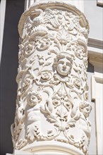 Putti and mythical creatures on stone columns