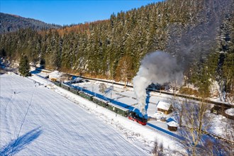 Pressnitztalbahn railway steam train steam locomotive in winter aerial view in Schmalzgrube