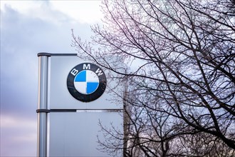 A sign of the car manufacturer BMW in front of a branch in Siemensstadt in Berlin