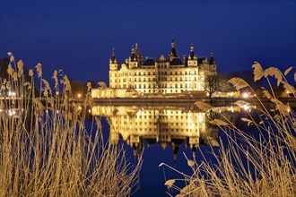Illuminated Schwerin Castle in the evening