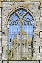 Window with Gothic tracery in the ruins of the Aulne Abbey