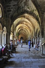 Tourists visiting cloister at the Fontfroide Abbey