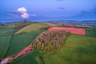 Sunset over fields and farms from a drone