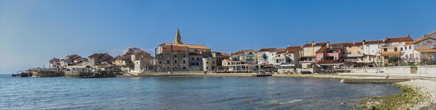Panoramic photo of the beach and city view of the coastal town of Umag
