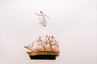 Sufi Dervish near a ship on a white background