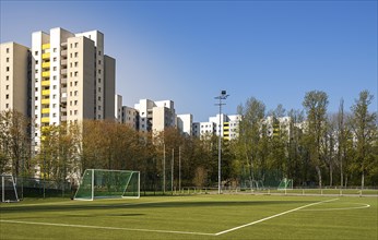 Football field and high-rise buildings in the Maerkisches Viertel residential area in Berlin Reinickendorf