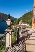 Balcony with View to Lake Lugano with Mountain and Blue Clear Sky From Morcote