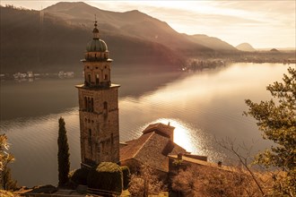 Church Tower Santa Maria del Sasso with Sunlight and Mountain on Lake Lugano in Morcote