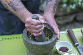 Spices are ground in a mortar