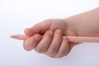 Hand holding a color pencil on a white background