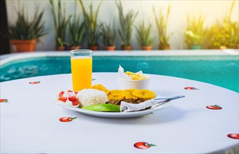 Vacation breakfast near a swimming pool