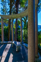 Patio with Column in the Forest on the Mountain Side and Blue Clear Sky in Park Scherrer in Morcote