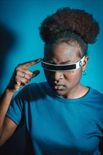 Young Black Woman Wearing Smart Glasses on Blue Background