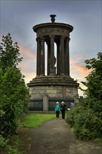 Walkers in front of Dugald Stewart Monument