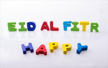 The word EID EL FITR written with colorful letter blocks