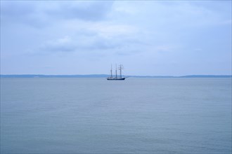 Lonely sailing ship in the distance off the coast of Sassnitz